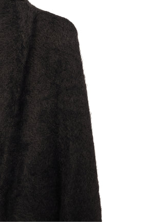 بونشو تريكو مزين بشراشيب